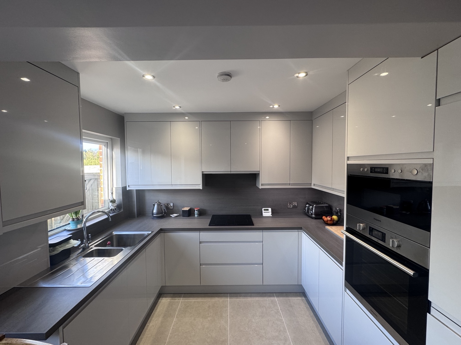 Strada · Gloss Light Grey kitchen by NI Kitchen Works